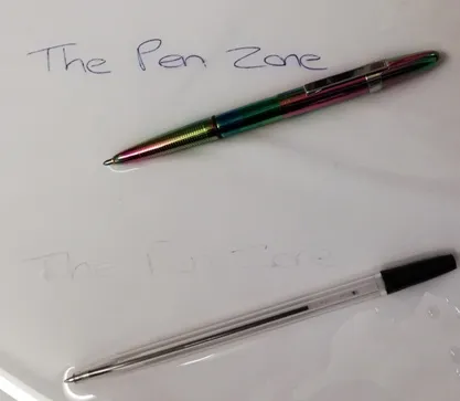 Fisher Space Pen compared to an ordinary ball point pen on wet paper.